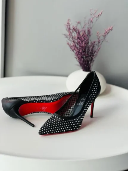 Christian Louboutin black high-heeled shoes adorned with rhinestones